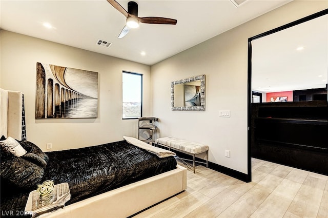 bedroom with light wood-type flooring and ceiling fan