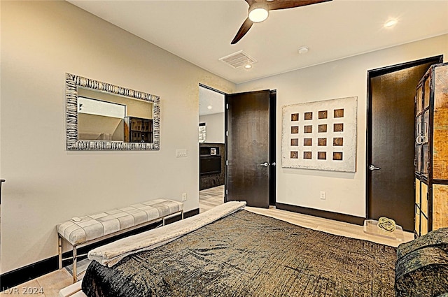 bedroom with ceiling fan and light wood-type flooring