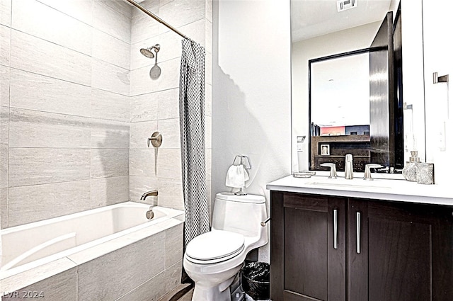 full bathroom featuring shower / bathtub combination with curtain, toilet, and vanity