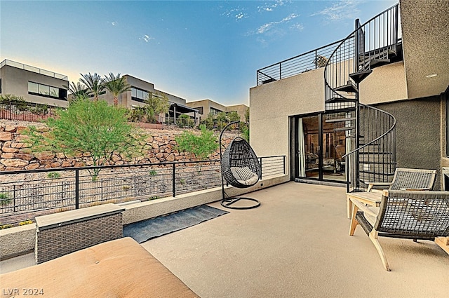 view of patio featuring a balcony