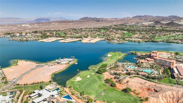 drone / aerial view featuring a water and mountain view