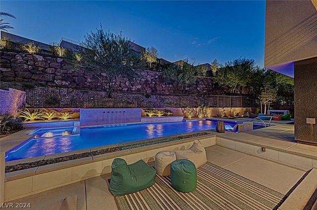 view of swimming pool featuring an in ground hot tub