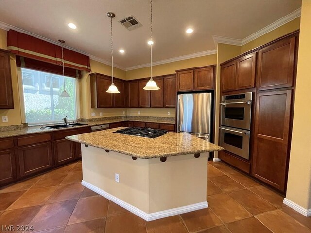 kitchen with a breakfast bar, a center island, light stone counters, stainless steel appliances, and pendant lighting