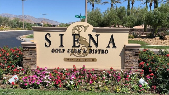 community / neighborhood sign featuring a mountain view