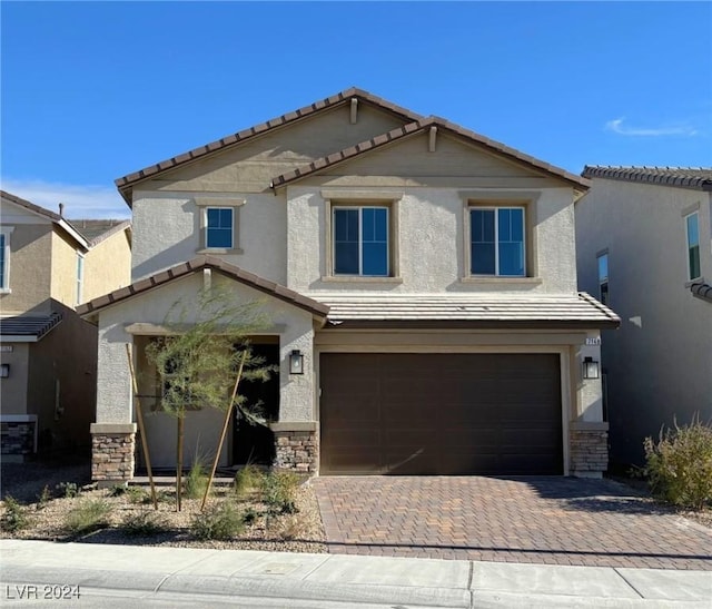 view of front of property featuring a garage