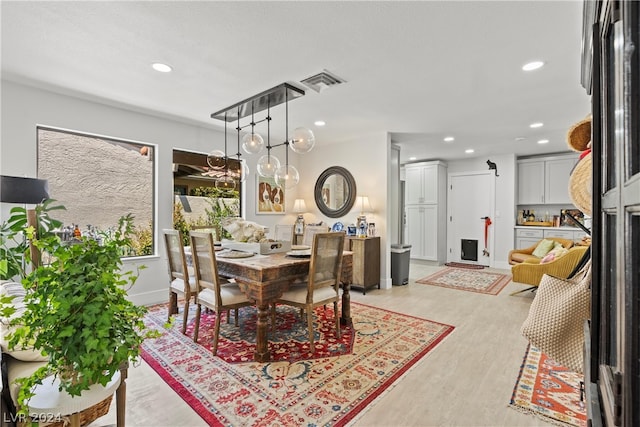 dining room featuring light hardwood / wood-style flooring