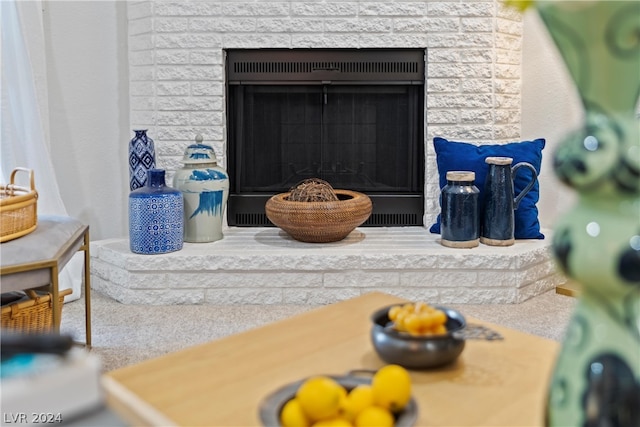 interior details featuring a stone fireplace