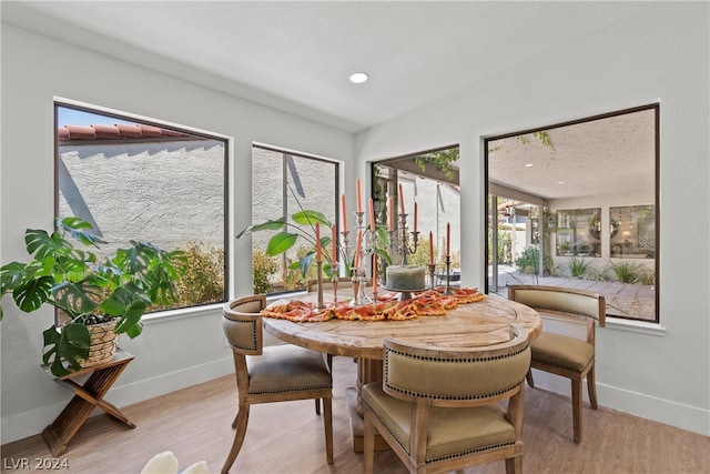 dining space with light wood-type flooring