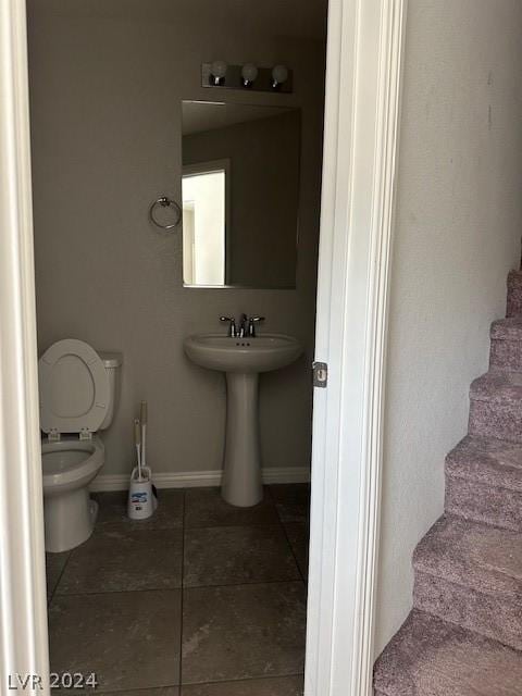 bathroom featuring tile patterned floors and toilet