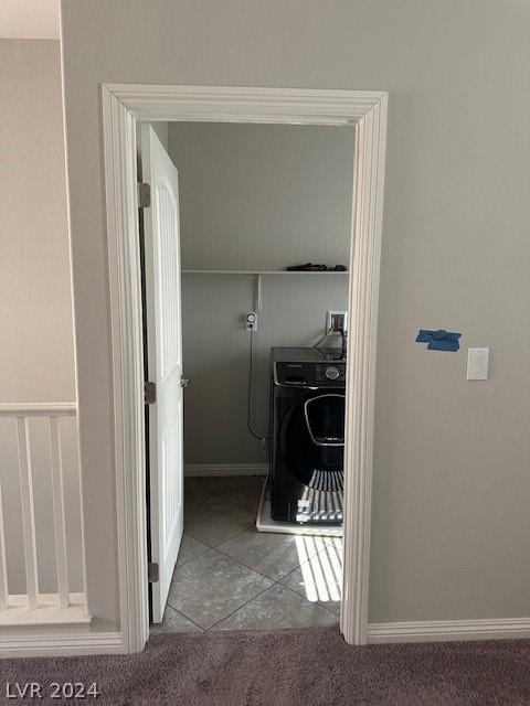 interior space with washer / clothes dryer and carpet