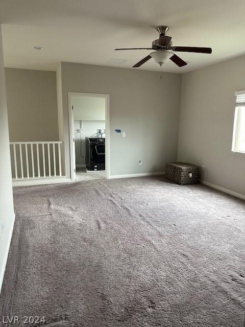 unfurnished room featuring washer / dryer, carpet floors, and ceiling fan