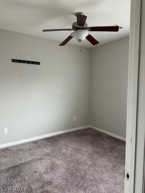 empty room with ceiling fan and carpet flooring