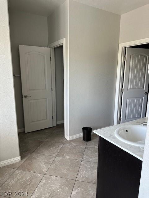 bathroom with vanity and tile patterned floors