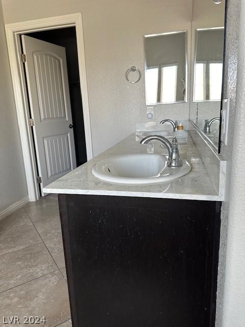 bathroom with vanity and tile patterned floors