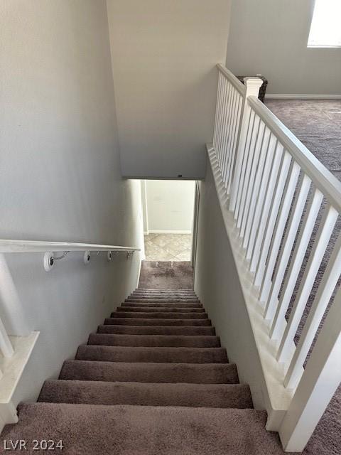 stairs featuring carpet floors