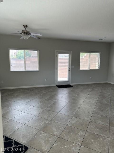 interior space featuring a textured ceiling and ceiling fan