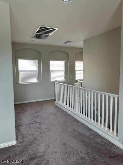 unfurnished room with carpet flooring