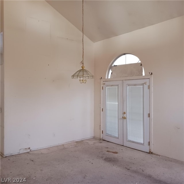 spare room featuring vaulted ceiling