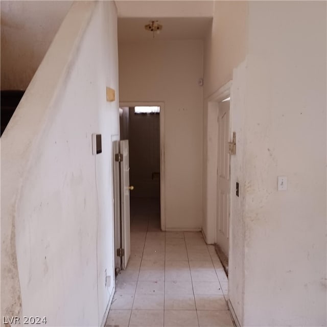 hallway with light tile patterned floors