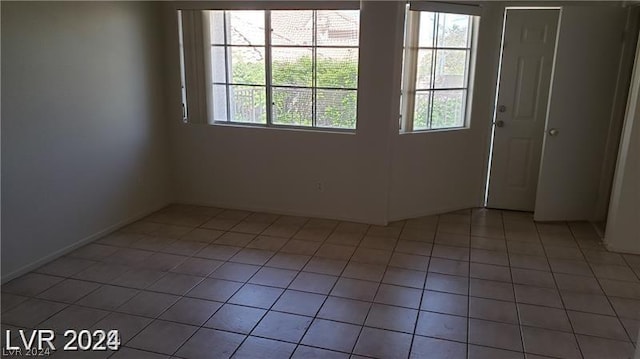 empty room with tile patterned floors