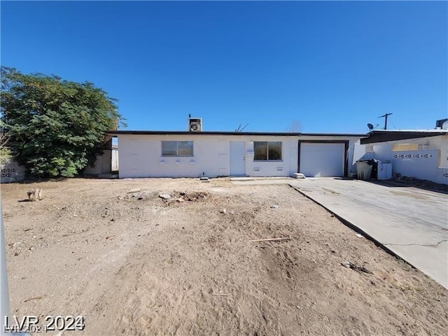 ranch-style house featuring a garage