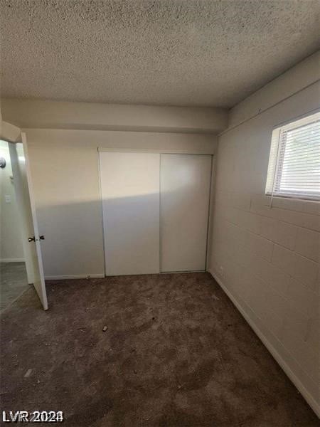 interior space with a textured ceiling