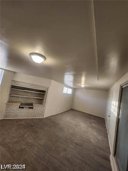 basement featuring dark wood-type flooring