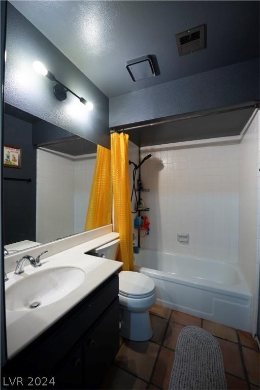 full bath with toilet, visible vents, vanity, tile patterned floors, and shower / tub combo with curtain