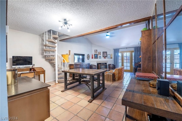 dining room with french doors, lofted ceiling, stairway, light tile patterned flooring, and a textured ceiling