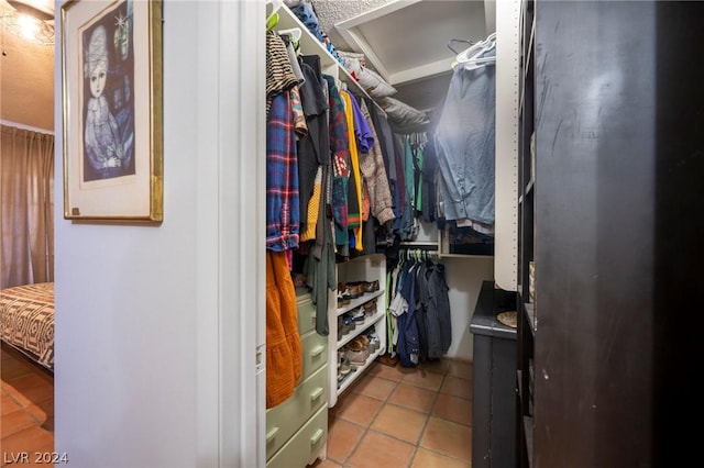 spacious closet featuring tile patterned floors