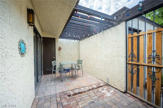 view of patio / terrace with outdoor dining area and a pergola