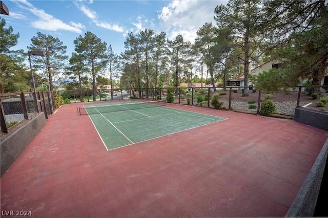 view of sport court with fence