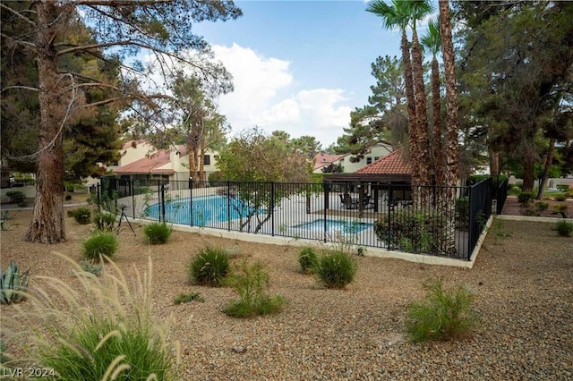 view of swimming pool featuring a fenced in pool, fence, and a patio