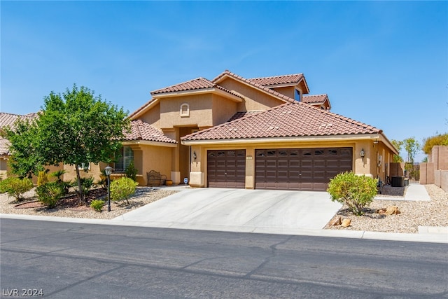 mediterranean / spanish house featuring a garage