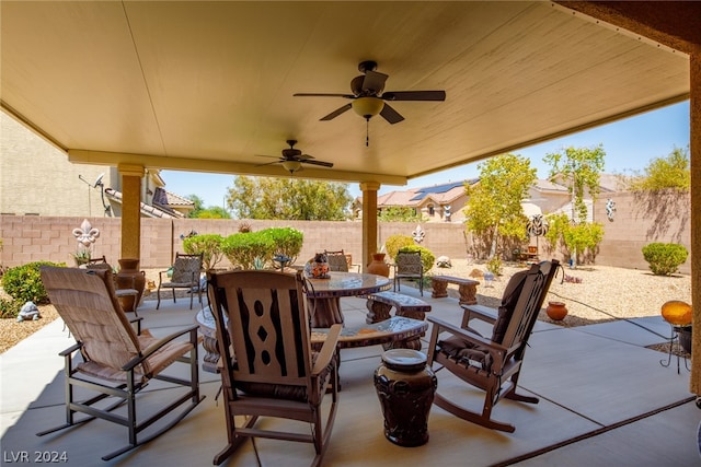 view of patio featuring an outdoor fire pit and ceiling fan