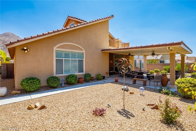 view of front of house with a patio area and ceiling fan