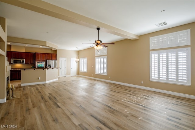 unfurnished living room featuring light hardwood / wood-style flooring, beamed ceiling, and ceiling fan with notable chandelier