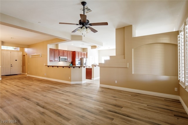 unfurnished living room with light hardwood / wood-style floors and ceiling fan