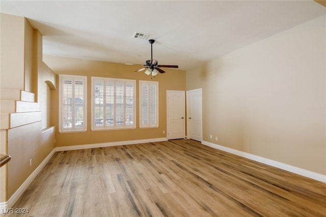 spare room featuring light hardwood / wood-style flooring and ceiling fan