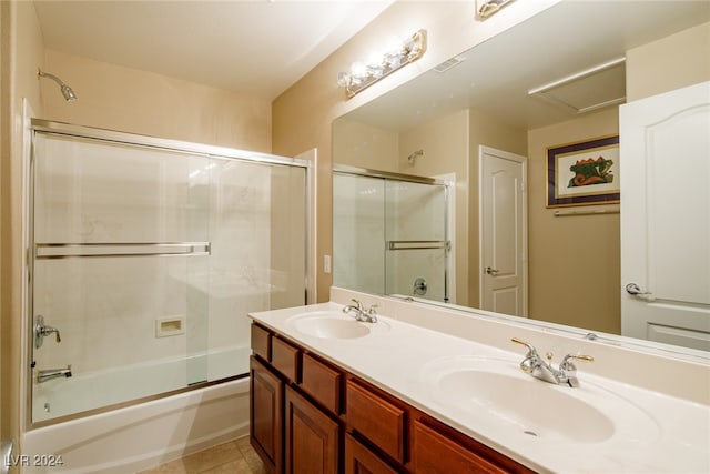 bathroom with vanity, enclosed tub / shower combo, and tile patterned floors