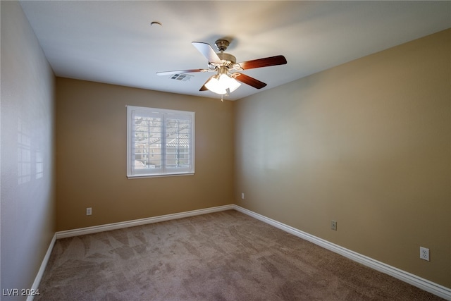 unfurnished room with light carpet and ceiling fan