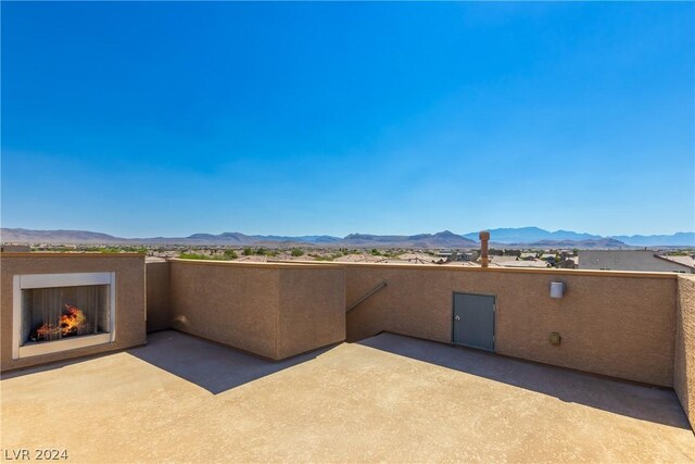 view of patio / terrace with a mountain view