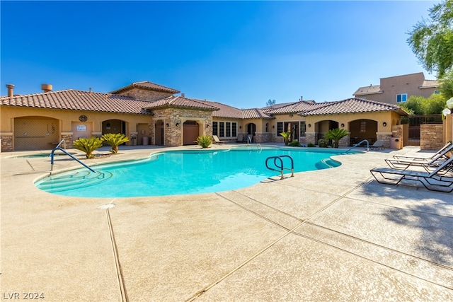 view of pool featuring a patio area