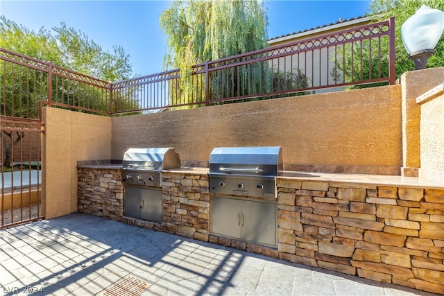 view of patio featuring area for grilling and exterior kitchen