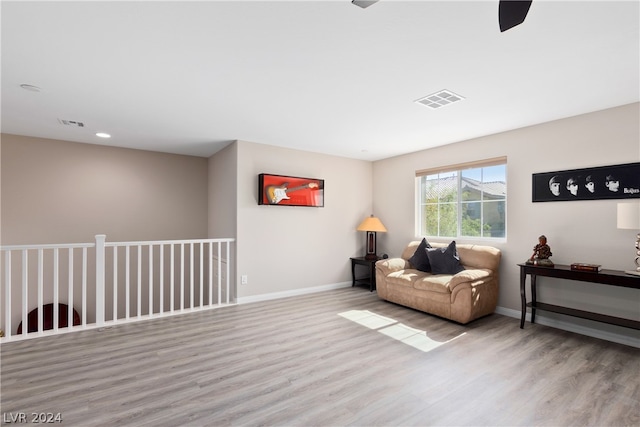 living area featuring hardwood / wood-style floors