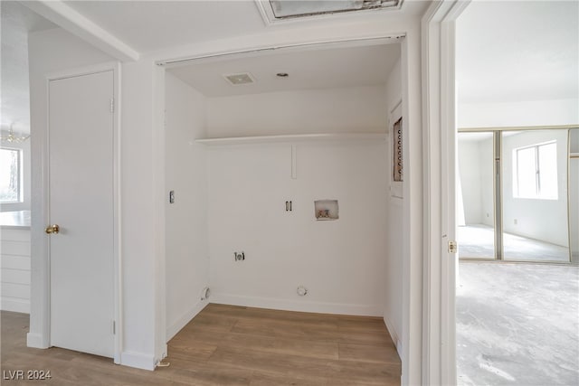 laundry room featuring light wood-type flooring and hookup for a gas dryer