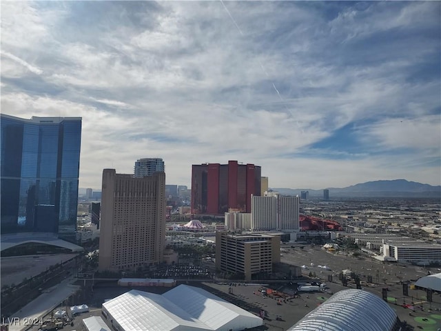 property's view of city with a mountain view