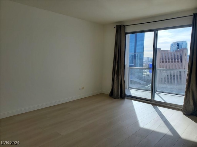 spare room featuring light hardwood / wood-style flooring