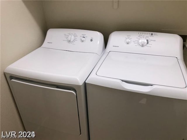 laundry area with washing machine and dryer