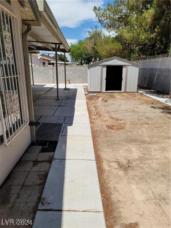 view of patio with a shed